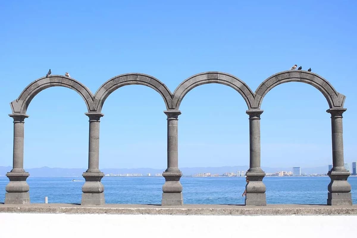 Stone arches on the Puerto Vallarta malecón overlooking the bay